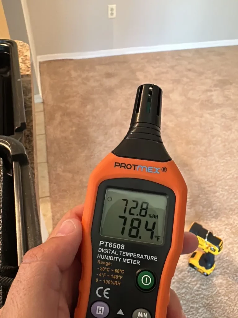 measuring indoor air temperature and humidity using digital temperature humidity meter in Jacksonville